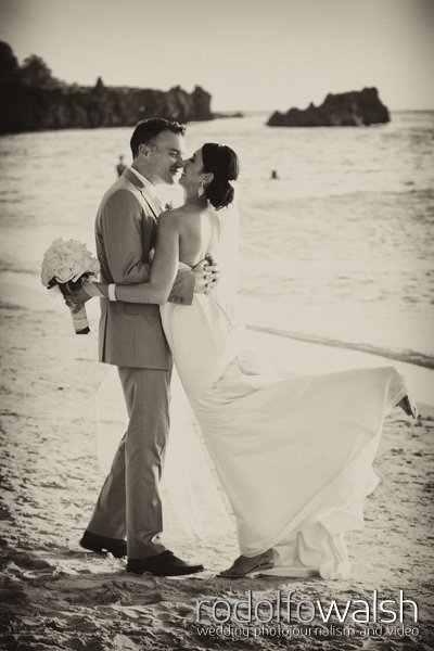 Roatan wedding photographers - bride and groom on white sand beach