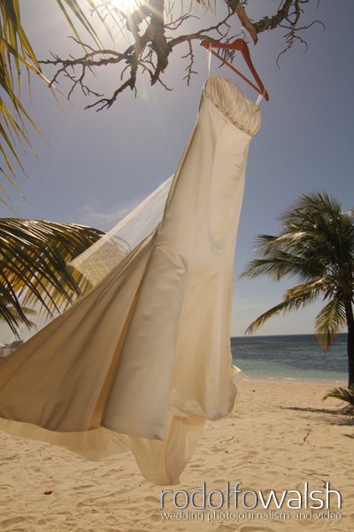 inifinity bay resort beach wedding- dress hanging from tree