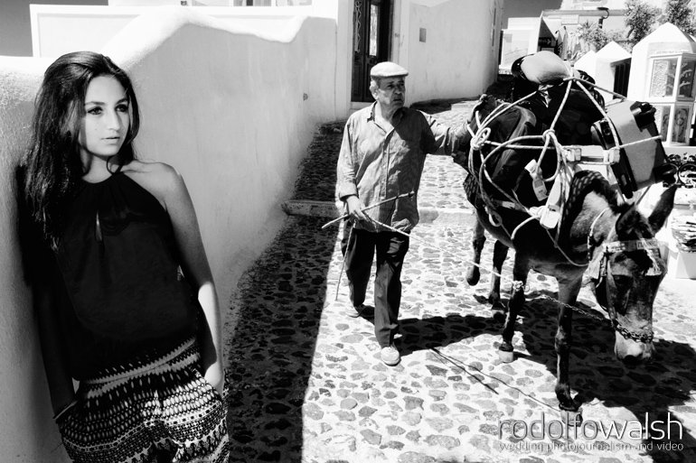 Santorini Wedding Photographer- fashion model and donkeys in the streets of Oia