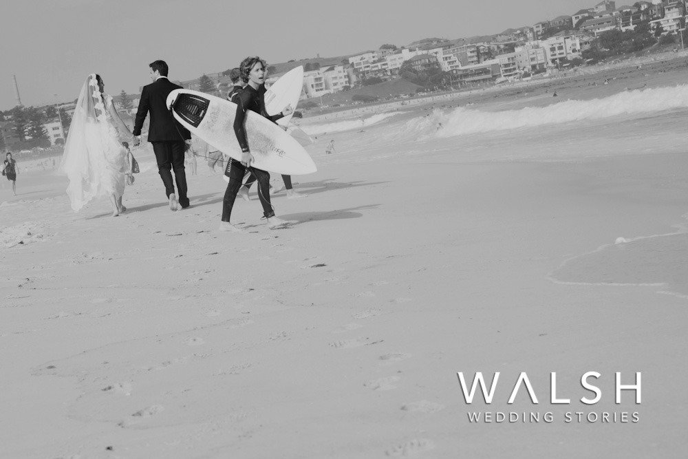 Bondi beach sydney australia wedding photographers-bride and groom walking on beach