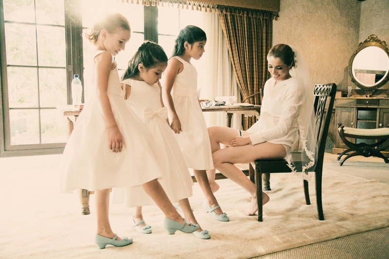 100 (15) Bride and flower girls showing their blue shoes in Antigua Guatemala - Casa Santo Domingo hotel wedding photographers