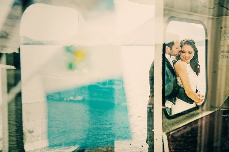 100 (20) Romantic photo of groom embracing bride on a boat in Panajachel Lake Atitlan - Hotel Atitlan weding photographer