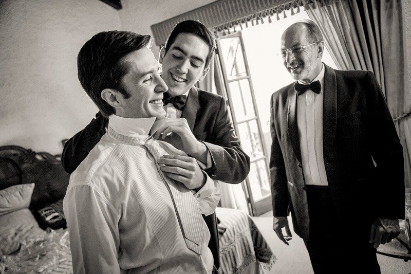 100 (7) Brother and father fixing tie of groom while getting ready - Casa Santo Domingo Antigua Guatemala wedding photographers