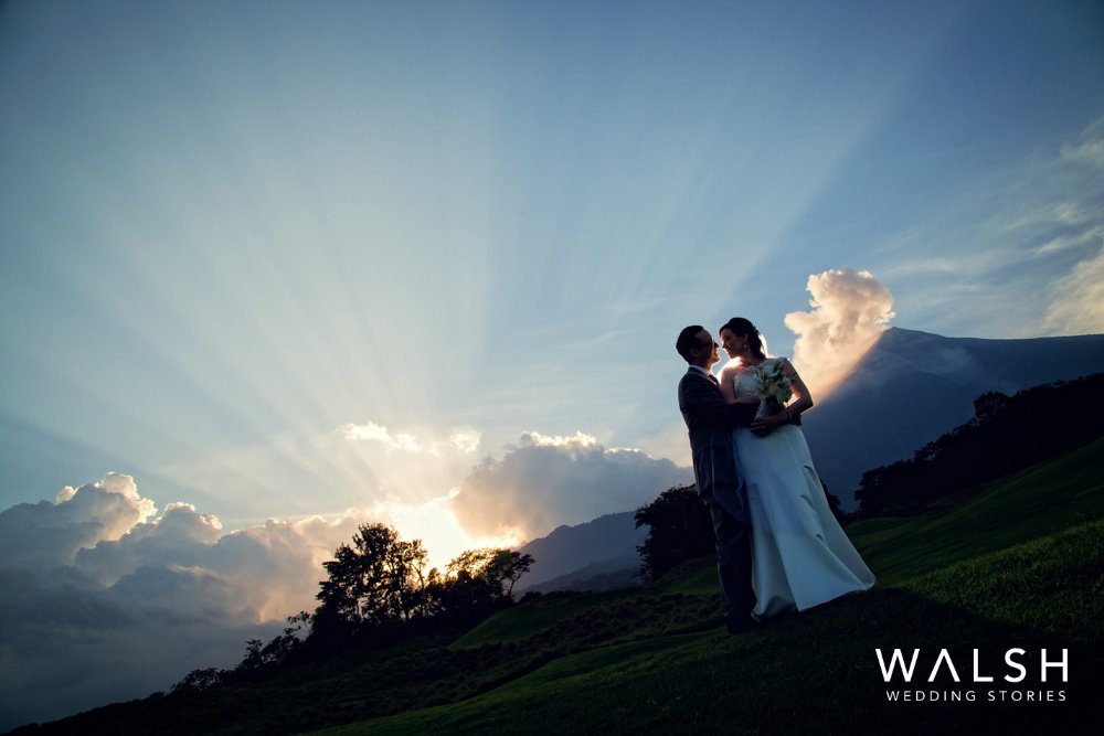Bride and groom with volcano and sunset at la reunion golf
