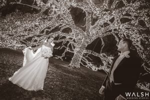 bride and groom with lighted tree at the houstonian hotel